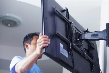 East Harlem Handyman mounting a TV